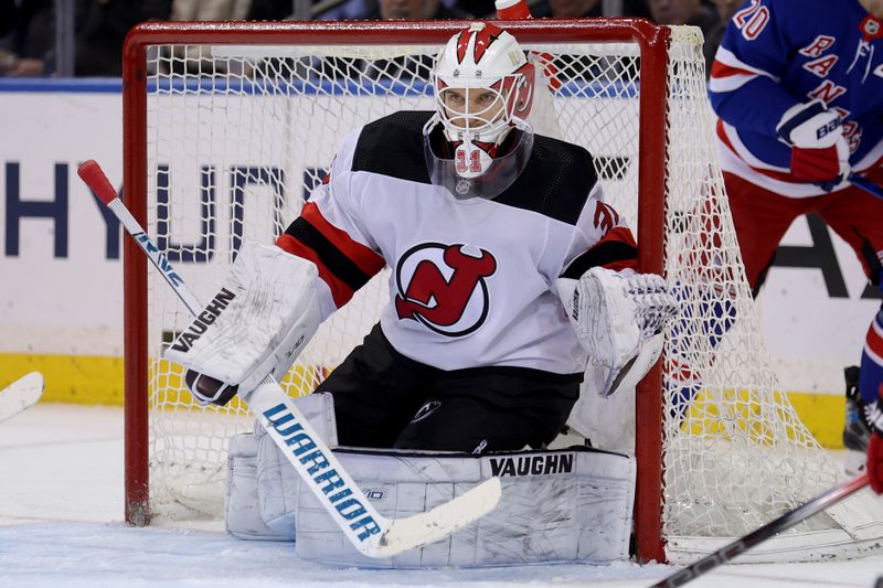 Mar 11, 2024; New York, New York, USA; New Jersey Devils goaltender Kaapo Kahkonen (31) tends net against the New York Rangers during the third period at Madison Square Garden. Mandatory Credit: Brad Penner-USA TODAY Sports