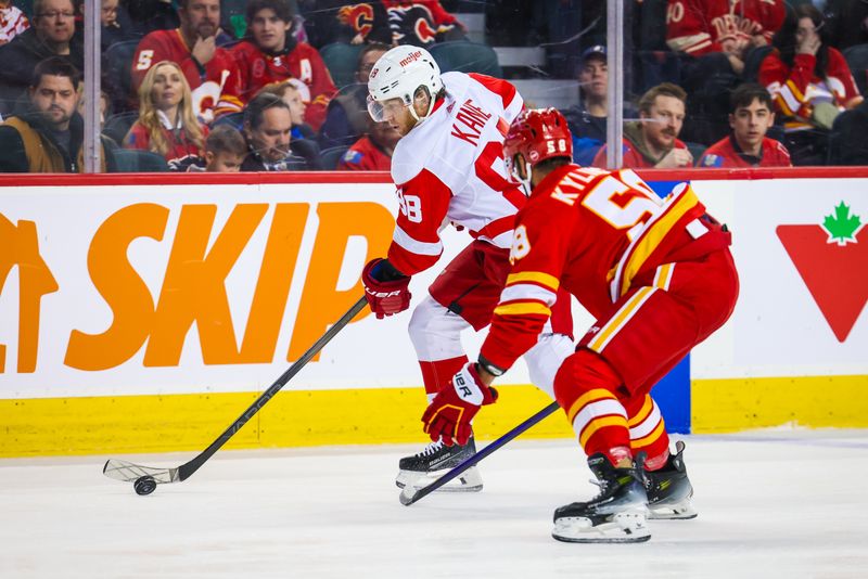 Feb 17, 2024; Calgary, Alberta, CAN; Detroit Red Wings right wing Patrick Kane (88) controls the puck against Calgary Flames defenseman Oliver Kylington (58) during the first period at Scotiabank Saddledome. Mandatory Credit: Sergei Belski-USA TODAY Sports