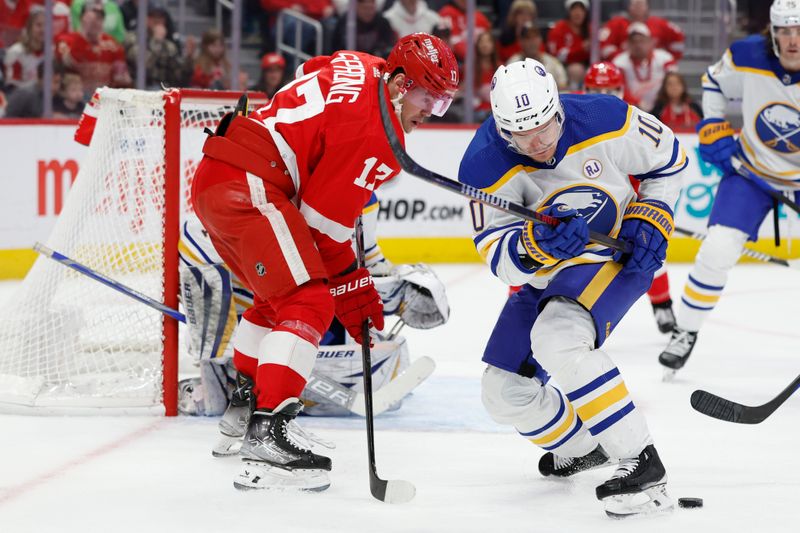 Mar 16, 2024; Detroit, Michigan, USA;  Detroit Red Wings right wing Daniel Sprong (17) and Buffalo Sabres defenseman Henri Jokiharju (10) battle for the puck in the second period at Little Caesars Arena. Mandatory Credit: Rick Osentoski-USA TODAY Sports