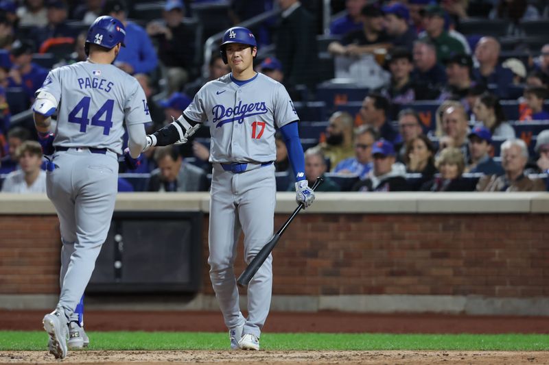 Oct 18, 2024; New York City, New York, USA; Los Angeles Dodgers outfielder Andy Pages (44) celebrates a home run with two-way player Shohei Ohtani (17) in the fourth inning against the New York Mets  during game five of the NLCS for the 2024 MLB playoffs at Citi Field. Mandatory Credit: Brad Penner-Imagn Images