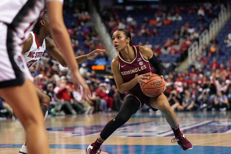 Mar 9, 2024; Greensboro, NC, USA; Florida State Seminoles guard Sara Bejedi (4) controls the ball against the NC State Wolfpack during the second half at Greensboro Coliseum. Mandatory Credit: David Yeazell-USA TODAY Sports