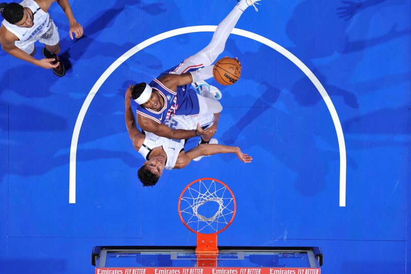 ORLANDO, FL - OCTOBER 18: Ricky Council IV #14 of the Philadelphia 76ers drives to the basket during the game against the Orlando Magic during a NBA preseason game on October 18, 2024 at Kia Center in Orlando, Florida. NOTE TO USER: User expressly acknowledges and agrees that, by downloading and or using this photograph, User is consenting to the terms and conditions of the Getty Images License Agreement. Mandatory Copyright Notice: Copyright 2024 NBAE (Photo by Fernando Medina/NBAE via Getty Images)