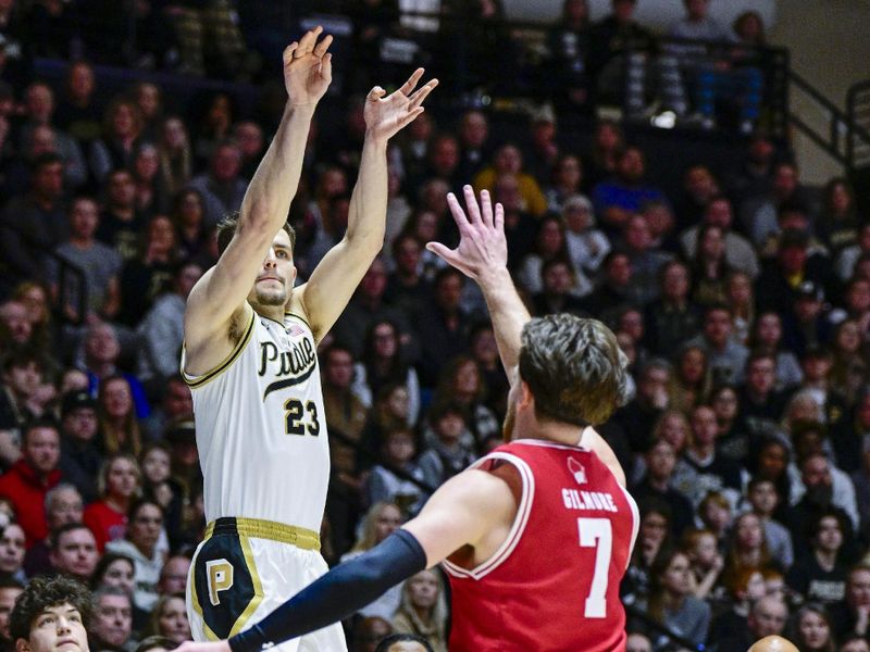 Feb 15, 2025; West Lafayette, Indiana, USA; Purdue Boilermakers forward Camden Heide (23) shoots the ball over Wisconsin Badgers forward Carter Gilmore (7) during the second half at Mackey Arena. Mandatory Credit: Marc Lebryk-Imagn Images