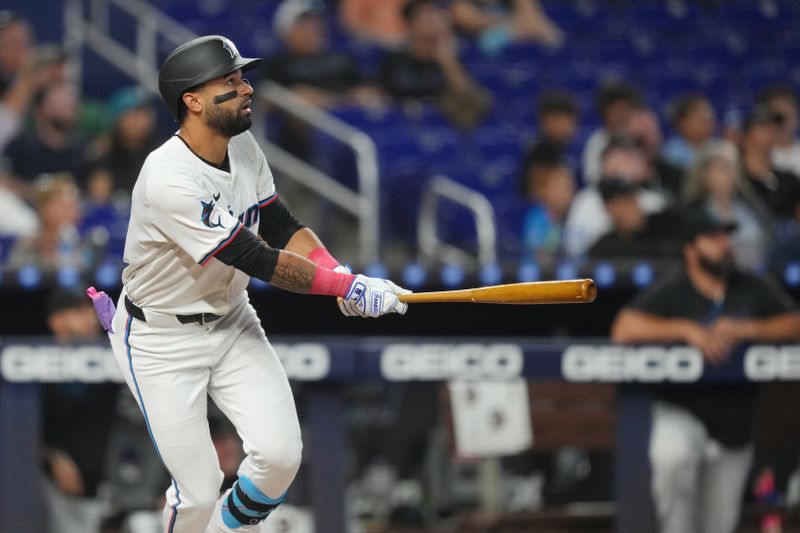 Aug 7, 2024; Miami, Florida, USA;  Miami Marlins left fielder Derek Hill (58) hits a grand slam in the first inning against the Cincinnati Reds at loanDepot Park. Mandatory Credit: Jim Rassol-USA TODAY Sports