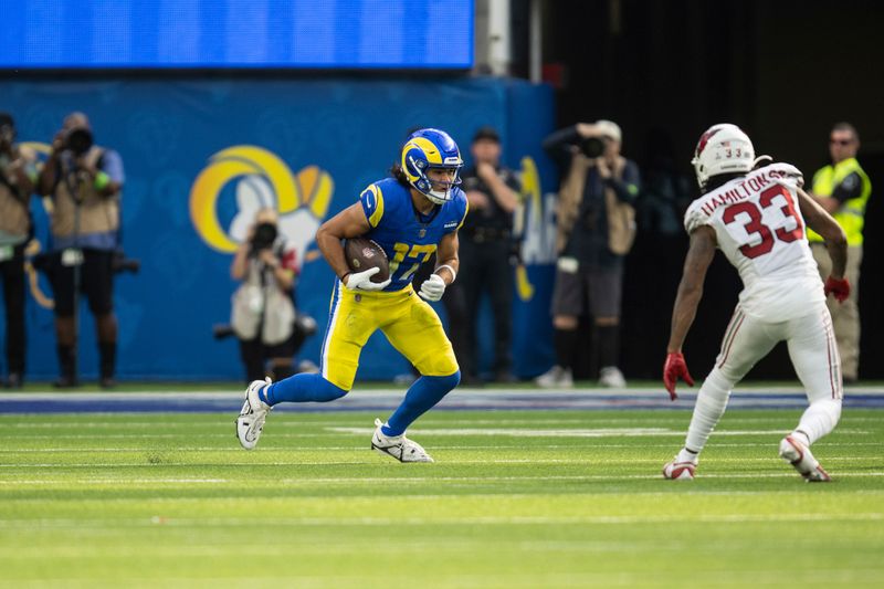 Los Angeles Rams wide receiver Puka Nacua (17) runs with the ball during an NFL football game against the Arizona Cardinals, Sunday, Oct. 15, 2023, in Inglewood, Calif. (AP Photo/Kyusung Gong)