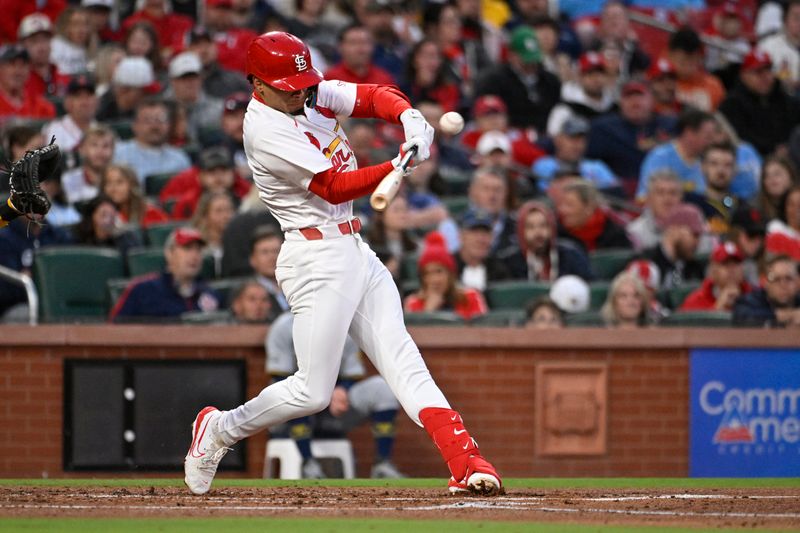 Apr 19, 2024; St. Louis, Missouri, USA; St. Louis Cardinals shortstop Masyn Winn (0) hits a single against the Milwaukee Brewers in the second inning at Busch Stadium. Mandatory Credit: Joe Puetz-USA TODAY Sports