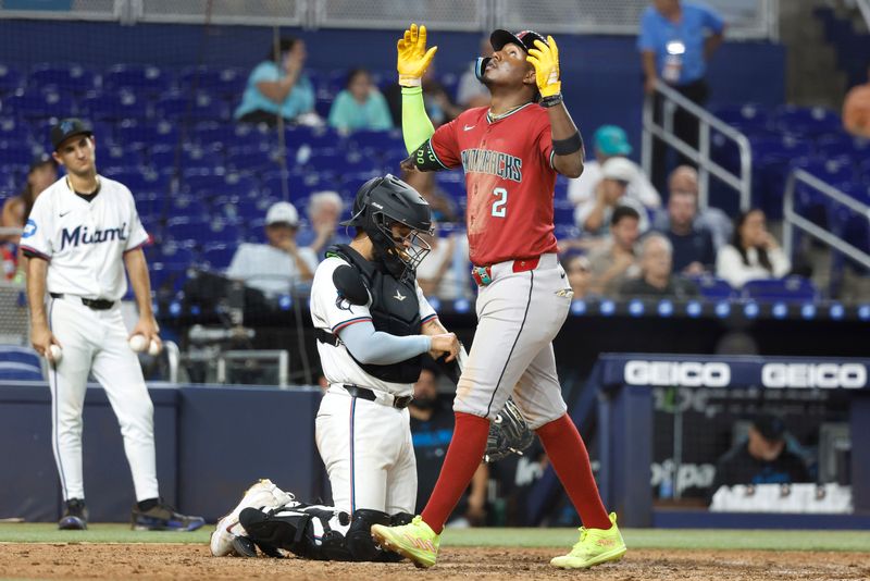 Aug 21, 2024; Miami, Florida, USA;  Arizona Diamondbacks shortstop Geraldo Perdomo (2) reacts after hitting a home run against the Miami Marlins in the eighth inning at loanDepot Park. Mandatory Credit: Rhona Wise-USA TODAY Sports