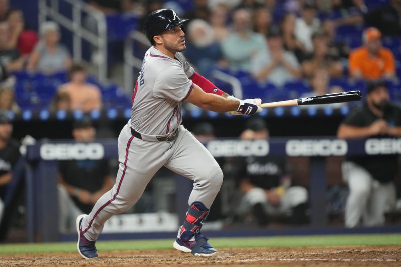 Sep 20, 2024; Miami, Florida, USA;  Atlanta Braves left fielder Ramon Laureano (18) hits a solo home run in the sixth inning against the Miami Marlins at loanDepot Park. Mandatory Credit: Jim Rassol-Imagn Images