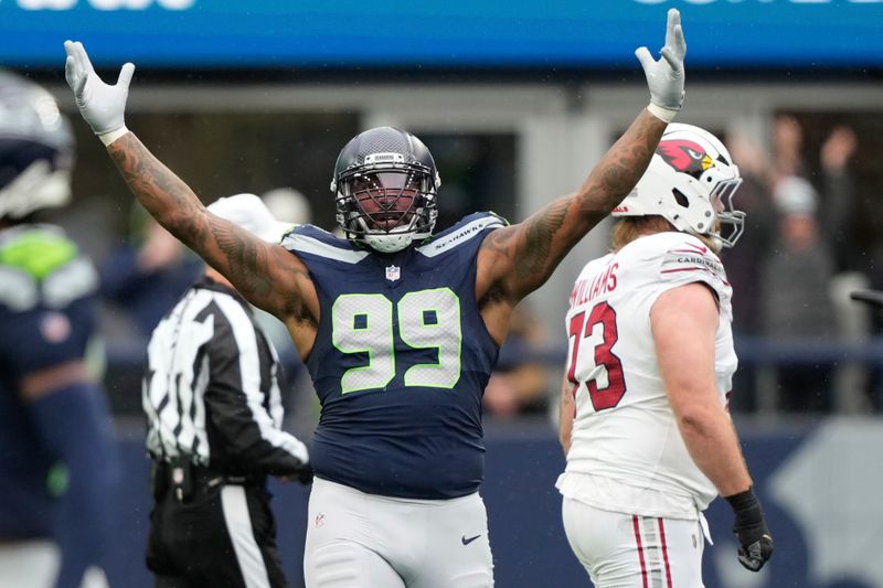 Seattle Seahawks defensive end Leonard Williams (99) celebrates a sack during an NFL football game against the Arizona Cardinals, Sunday, Nov. 24, 2024, in Seattle. (AP Photo/Stephen Brashear)