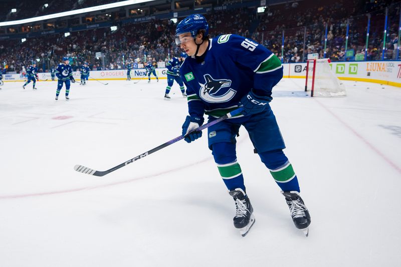 Nov 15, 2023; Vancouver, British Columbia, CAN; Vancouver Canucks forward Andrei Kuzmenko (96) skates during warm up prior to a game against the New York Islanders at Rogers Arena. Mandatory Credit: Bob Frid-USA TODAY Sports