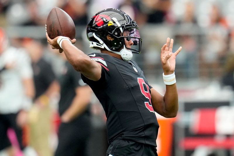 Arizona Cardinals quarterback Joshua Dobbs (9) warms up prior to an NFL football game against the Cincinnati Bengals, Sunday, Oct. 8, 2023, in Glendale, Ariz. (AP Photo/Ross D. Franklin)