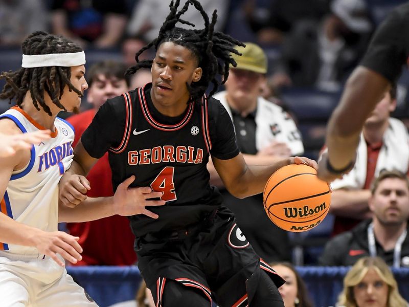 Mar 14, 2024; Nashville, TN, USA;  Georgia Bulldogs guard Silas Demary Jr. (4) backs down Florida Gators guard Walter Clayton Jr. (1) during the second half at Bridgestone Arena. Mandatory Credit: Steve Roberts-USA TODAY Sports