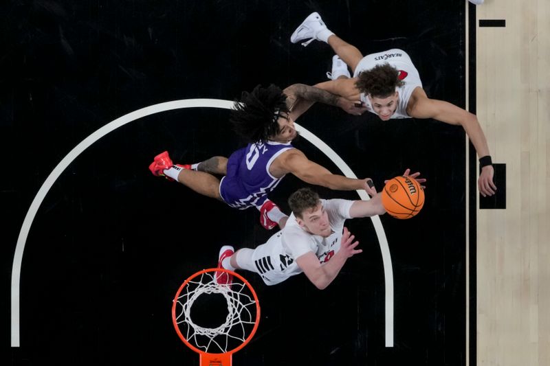 sJan 16, 2024; Cincinnati, Ohio, USA;  Cincinnati Bearcats forward Viktor Lakhin (30) grabs a rebound as TCU Horned Frogs guard Micah Peavy (0) battles for space against Cincinnati Bearcats guard Dan Skillings Jr. (0) in the second half at Fifth Third Arena. Mandatory Credit: Aaron Doster-USA TODAY Sports