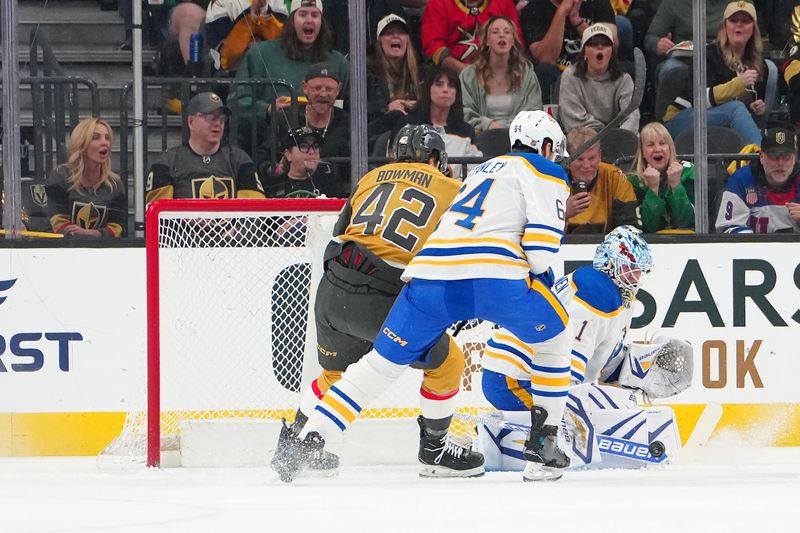 Mar 17, 2026; Las Vegas, Nevada, USA; Buffalo Sabres goaltender Ukko-Pekka Luukkonen (1) makes a save in front of Vegas Golden Knights right wing Braeden Bowman (42) and defenseman Logan Stanley (64) during the first period at T-Mobile Arena. Mandatory Credit: Stephen R. Sylvanie-Imagn Images