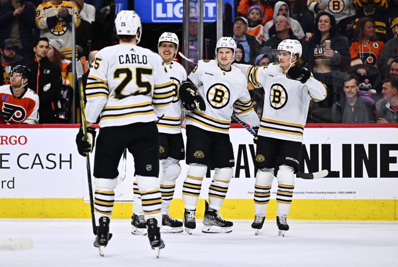 Jan 27, 2024; Philadelphia, Pennsylvania, USA; Boston Bruins defenseman Hampus Lindholm (27), center Danton Heinen (43), and center Jesper Boqvist (70) celebrate a goal against the Philadelphia Flyers in the first period at Wells Fargo Center. Mandatory Credit: Kyle Ross-USA TODAY Sports