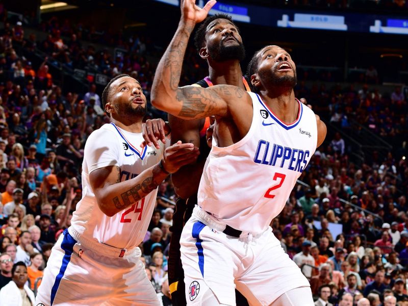 PHOENIX, AZ - APRIL 18: Norman Powell #24 of the LA Clippers, Deandre Ayton #22 of the Phoenix Suns and Kawhi Leonard #2 of the LA Clippers watch for the rebound during Round 1 Game 2 of the 2023 NBA Playoffs on April 18, 2023 at Footprint Center in Phoenix, Arizona. NOTE TO USER: User expressly acknowledges and agrees that, by downloading and or using this photograph, user is consenting to the terms and conditions of the Getty Images License Agreement. Mandatory Copyright Notice: Copyright 2023 NBAE (Photo by Barry Gossage/NBAE via Getty Images)