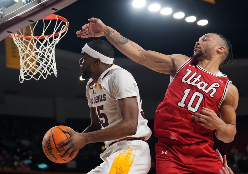 Feb 18, 2023; Tempe, Arizona, USA; Arizona State Sun Devils guard Devan Cambridge (35) goes to the net against Utah Utes guard Marco Anthony (10) during the second half at Desert Financial Arena. Mandatory Credit: Joe Camporeale-USA TODAY Sports