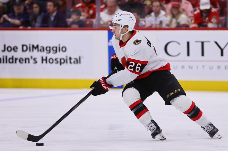 Apr 9, 2024; Sunrise, Florida, USA; Ottawa Senators defenseman Erik Brannstrom (26) moves the puck against the Florida Panthers during the first period at Amerant Bank Arena. Mandatory Credit: Sam Navarro-USA TODAY Sports