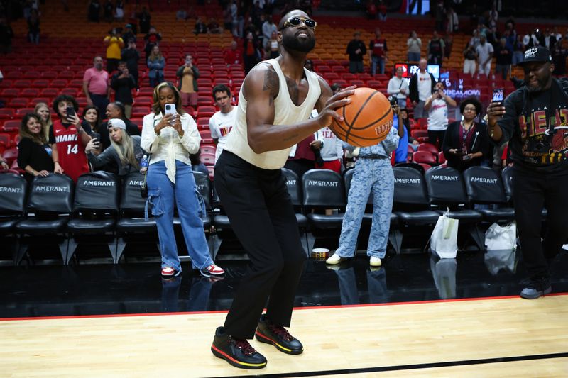 MIAMI, FLORIDA - JANUARY 14: Former Miami Heat player Dwayne Wade shoots a basket after a game between the Charlotte Hornets and Miami Heat at Kaseya Center on January 14, 2024 in Miami, Florida. NOTE TO USER: User expressly acknowledges and agrees that, by downloading and or using this photograph, User is consenting to the terms and conditions of the Getty Images License Agreement.  (Photo by Megan Briggs/Getty Images)