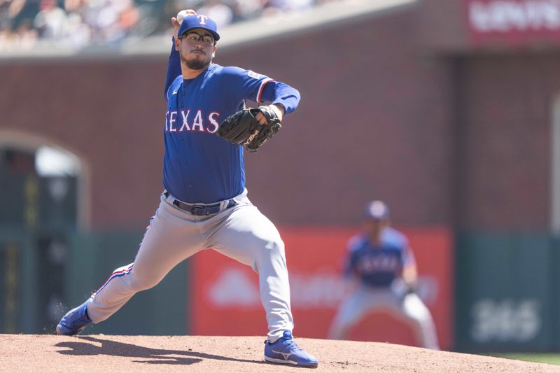 Aug 13, 2023; San Francisco, California, USA; Texas Rangers starting pitcher Dane Dunning (33) pitches during the first inning against the San Francisco Giants at Oracle Park. Mandatory Credit: Stan Szeto-USA TODAY Sports