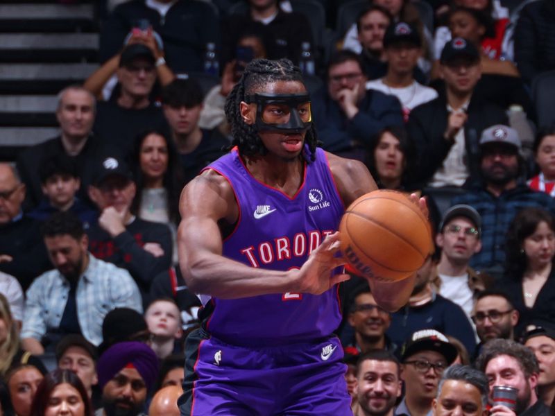 TORONTO, CANADA - APRIL 3:  Jonathan Mogbo #2 of the Toronto Raptors passes the ball during the game against the Portland Trail Blazers     on April 3, 2025 at the Scotiabank Arena in Toronto, Ontario, Canada.  NOTE TO USER: User expressly acknowledges and agrees that, by downloading and or using this Photograph, user is consenting to the terms and conditions of the Getty Images License Agreement.  Mandatory Copyright Notice: Copyright 2025 NBAE (Photo by Vaughn Ridley/NBAE via Getty Images)