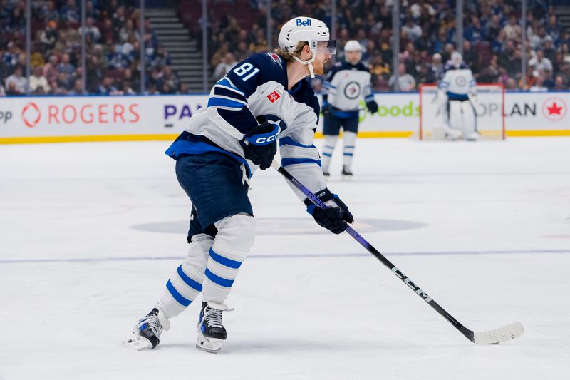 Mar 9, 2024; Vancouver, British Columbia, CAN; Winnipeg Jets forward Kyle Connor (81) handles the puck against the Vancouver Canucks in the third period at Rogers Arena. Canucks won 5-0. Mandatory Credit: Bob Frid-USA TODAY Sports