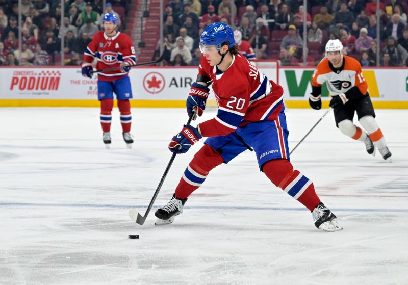 Apr 9, 2024; Montreal, Quebec, CAN; Montreal Canadiens forward Juraj Slafkovsky (20) plays the puck during the second period of the game against the Philadelphia Flyers at the Bell Centre. Mandatory Credit: Eric Bolte-USA TODAY Sports