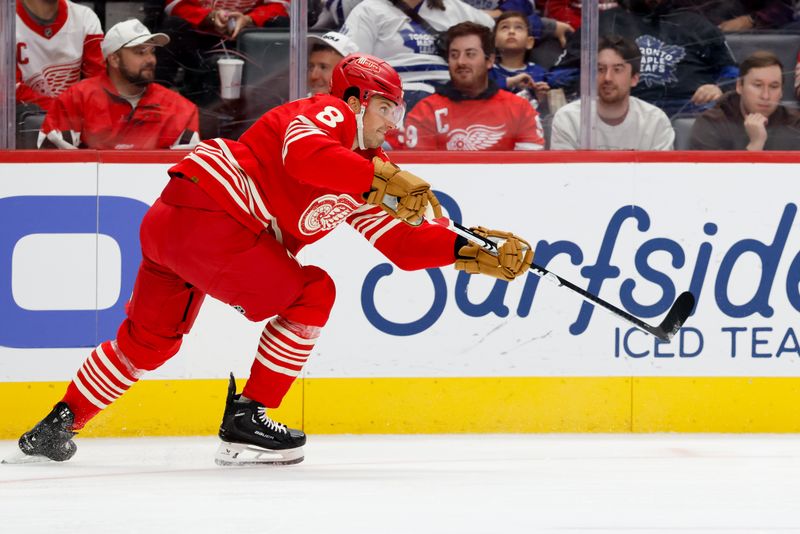 Oct 11, 2025; Detroit, Michigan, USA;  Detroit Red Wings defenseman Ben Chiarot (8) passes in the first period against the Toronto Maple Leafs at Little Caesars Arena. Mandatory Credit: Rick Osentoski-Imagn Images