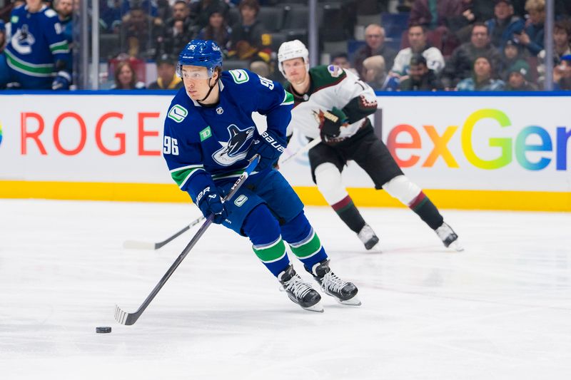 Jan 18, 2024; Vancouver, British Columbia, CAN; Vancouver Canucks forward Andrei Kuzmenko (96) handles the puck against the Arizona Coyotes in the first period at Rogers Arena. Mandatory Credit: Bob Frid-USA TODAY Sports