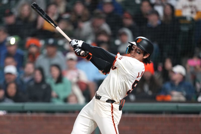 Apr 9, 2024; San Francisco, California, USA; San Francisco Giants center fielder Jung Hoo Lee (51) hits a single against the Washington Nationals during the ninth inning at Oracle Park. Mandatory Credit: Darren Yamashita-USA TODAY Sports