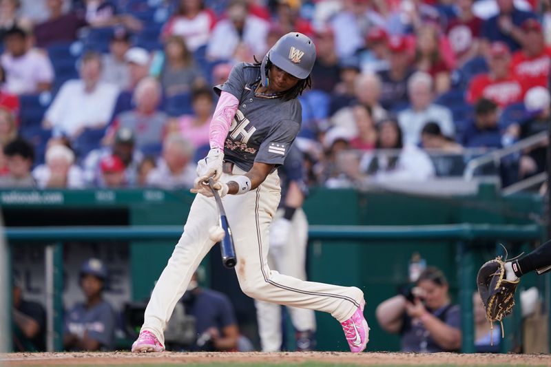 Jun 14, 2024; Washington, District of Columbia, USA; Washington Nationals shortstop CJ Abrams (5) hits an RBI single in the third inning against the Miami Marlins at Nationals Park. Mandatory Credit: Amber Searls-USA TODAY Sports