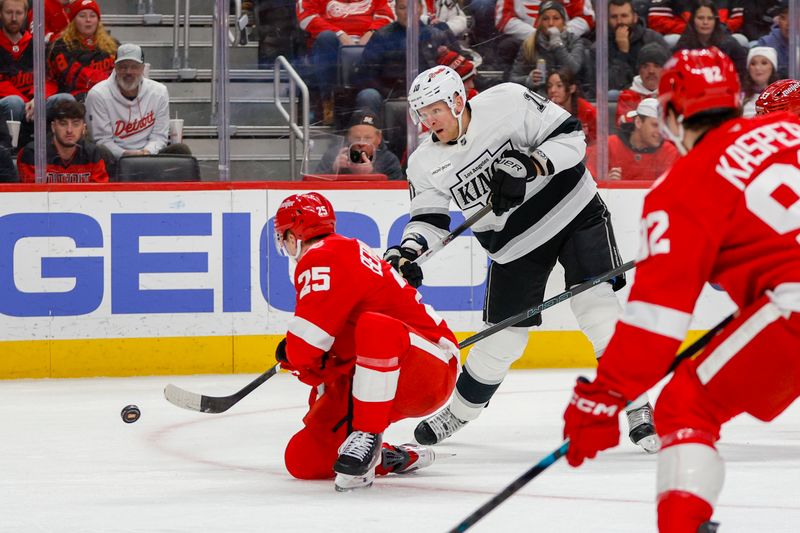 Jan 27, 2026; Detroit, Michigan, USA; Los Angeles Kings right wing Corey Perry (10) takes a shot on goal while Detroit Red Wings defenseman Jacob Bernard-Docker (25) tries to block his shot during the first period at Little Caesars Arena. Mandatory Credit: Brian Bradshaw Sevald-Imagn Images