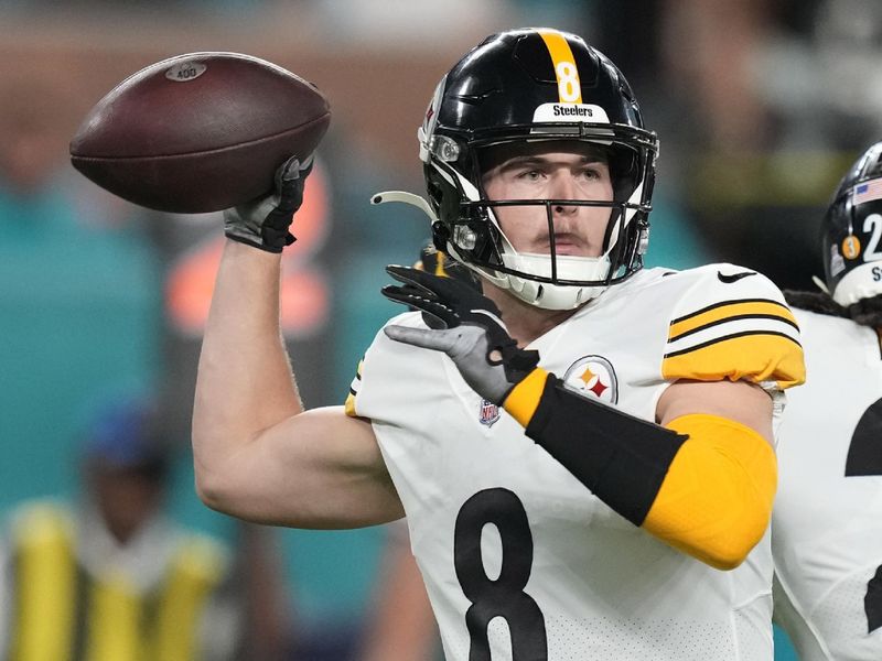 Pittsburgh Steelers quarterback Kenny Pickett (8) aims a pass during the first half of an NFL football game against the Miami Dolphins, Sunday, Oct. 23, 2022, in Miami Gardens, Fla. (AP Photo/Rebecca Blackwell)