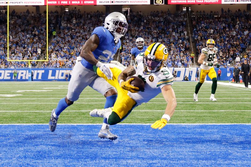 Green Bay Packers wide receiver Christian Watson (9) makes a reception for a td against the Detroit Lions in the second half of an NFL football game at Ford Field in Detroit, Thursday, Nov. 23, 2023. (AP Photo/Rick Osentoski)