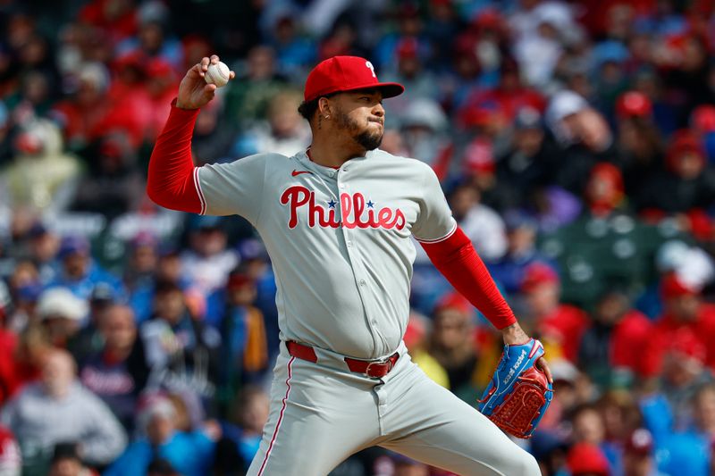 Apr 25, 2025; Chicago, Illinois, USA; Philadelphia Phillies starting pitcher Taijuan Walker (99) delivers a pitch against the Chicago Cubs during the first inning at Wrigley Field. Mandatory Credit: Kamil Krzaczynski-Imagn Images