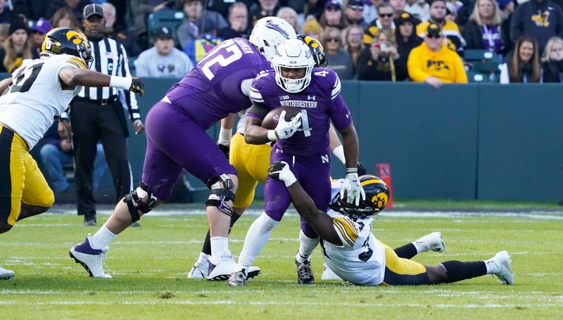 Nov 4, 2023; Chicago, Illinois, USA; Northwestern Wildcats linebacker Jason Reynolds II (40) runs against the Iowa Hawkeyes during the first half at Wrigley Field. Mandatory Credit: David Banks-USA TODAY Sports