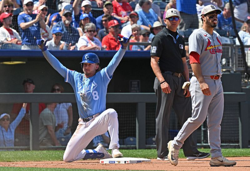 May 18, 2025; Kansas City, Missouri, USA;  Kansas City Royals pinch hitter Drew Waters (8) reacts after hitting a triple in the seventh inning, as St. Louis Cardinals third baseman Nolan Arenado (28) looks on at Kauffman Stadium. Mandatory Credit: Peter Aiken-Imagn Images