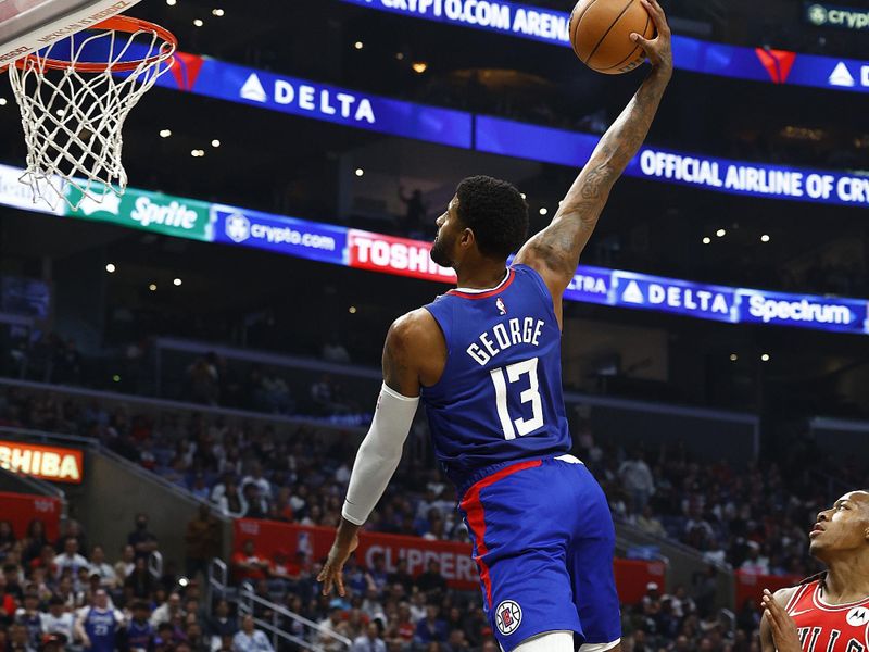 LOS ANGELES, CALIFORNIA - MARCH 09:  Paul George #13 of the LA Clippers makes a slam dunk against the Chicago Bulls in the first half at Crypto.com Arena on March 09, 2024 in Los Angeles, California.  NOTE TO USER: User expressly acknowledges and agrees that, by downloading and/or using this photograph, user is consenting to the terms and conditions of the Getty Images License Agreement.  (Photo by Ronald Martinez/Getty Images)