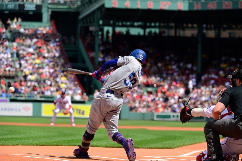 Aug 27, 2023; Boston, Massachusetts, USA; Los Angeles Dodgers second baseman Mookie Betts (50) hits a single during the first inning against the Boston Red Sox at Fenway Park. Mandatory Credit: Eric Canha-USA TODAY Sports