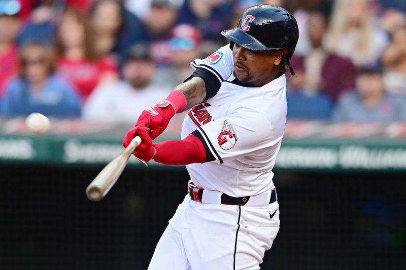 Apr 8, 2024; Cleveland, Ohio, USA; Cleveland Guardians third baseman Jose Ramirez (11) hits a two run home run during the fifth inning against the Chicago White Sox at Progressive Field. Mandatory Credit: David Dermer-USA TODAY Sports