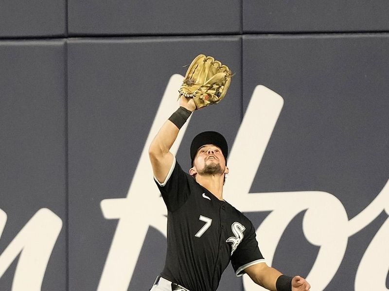 May 22, 2024; Toronto, Ontario, CAN; Chicago White Sox center fielder Dominic Fletcher (7) catches a fly ball hit by Toronto Blue Jays first baseman Vladimir Guerrero Jr. (not pictured) during the seventh inning at Rogers Centre. Mandatory Credit: John E. Sokolowski-USA TODAY Sports