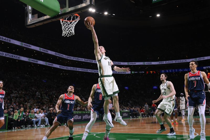 BOSTON, MA - APRIL 14: Payton Pritchard #11 of the Boston Celtics drives to the basket during the game  against the Washington Wizards on April 14, 2024 at the TD Garden in Boston, Massachusetts. NOTE TO USER: User expressly acknowledges and agrees that, by downloading and or using this photograph, User is consenting to the terms and conditions of the Getty Images License Agreement. Mandatory Copyright Notice: Copyright 2024 NBAE  (Photo by Brian Babineau/NBAE via Getty Images)