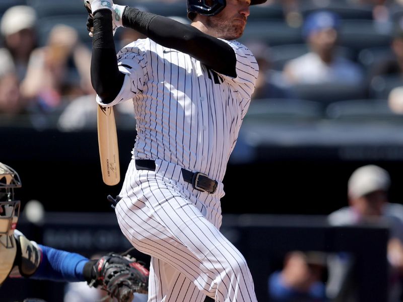 May 17, 2025; Bronx, New York, USA; New York Yankees center fielder Cody Bellinger (35) follows through on a solo home run against the New York Mets during the sixth inning at Yankee Stadium. Mandatory Credit: Brad Penner-Imagn Images
