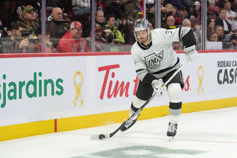 Nov 2, 2023; Ottawa, Ontario, CAN; Los Angeles Kings defenseman Andreas Englund (3) skates with the puck in the first period against the Ottawa Senators at the Canadian Tire Centre. Mandatory Credit: Marc DesRosiers-USA TODAY Sports