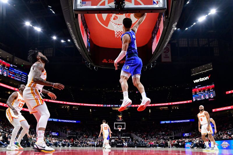 ATLANTA, GA - JANUARY 26: Josh Green #8 of the Dallas Mavericks dunks the ball during the game against the Atlanta Hawks on January 26, 2024 at State Farm Arena in Atlanta, Georgia.  NOTE TO USER: User expressly acknowledges and agrees that, by downloading and/or using this Photograph, user is consenting to the terms and conditions of the Getty Images License Agreement. Mandatory Copyright Notice: Copyright 2024 NBAE (Photo by Adam Hagy/NBAE via Getty Images)