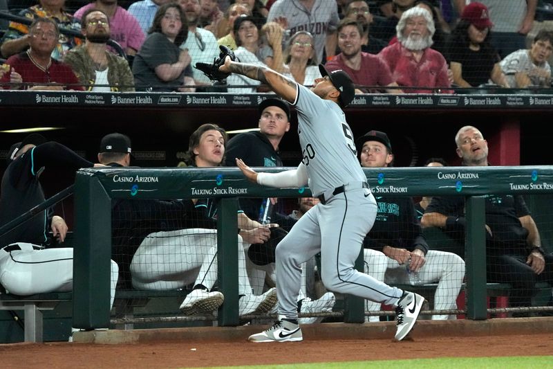 Jun 14, 2024; Phoenix, Arizona, USA; Chicago White Sox third base Lenyn Sosa (50) makes the catch against the Arizona Diamondbacks in the first inning at Chase Field. Mandatory Credit: Rick Scuteri-USA TODAY Sports