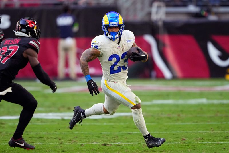 Los Angeles Rams running back Kyren Williams runs with the ball during the first half of an NFL football game against the Arizona Cardinals, Sunday, Nov. 26, 2023, in Glendale, Ariz. (AP Photo/Matt York)