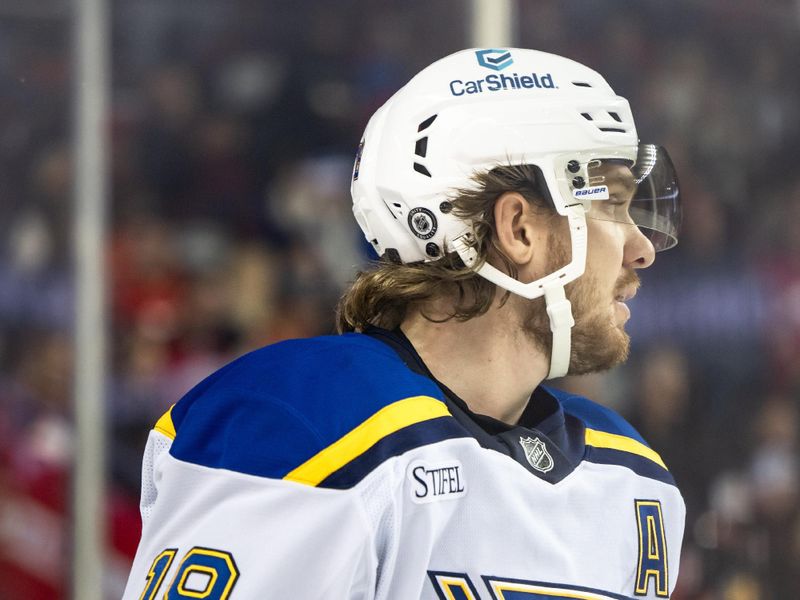 Dec 5, 2024; Calgary, Alberta, CAN; St. Louis Blues center Robert Thomas (18) looks on against the Calgary Flames during the first period at Scotiabank Saddledome. Mandatory Credit: Brett Holmes-Imagn Images