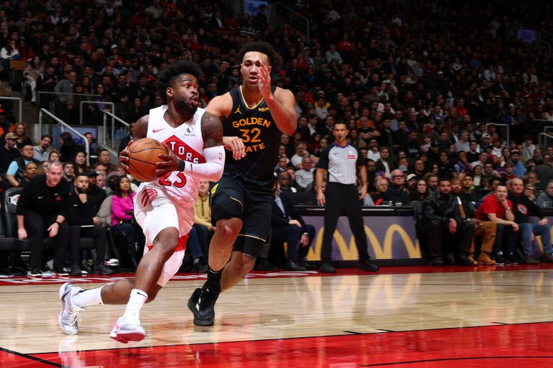 TORONTO, CANADA - JANUARY 13: Jamal Shead #23 of the Toronto Raptors drives to the basket during the game against the Golden State Warriors on January 13, 2025 at the Scotiabank Arena in Toronto, Ontario, Canada.  NOTE TO USER: User expressly acknowledges and agrees that, by downloading and or using this Photograph, user is consenting to the terms and conditions of the Getty Images License Agreement.  Mandatory Copyright Notice: Copyright 2025 NBAE (Photo by Vaughn Ridley/NBAE via Getty Images)