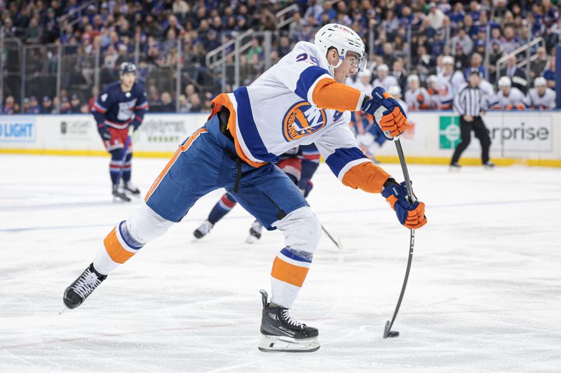 Mar 17, 2024; New York, New York, USA; New York Islanders center Brock Nelson (29) shoots the puck against the New York Rangers during the first period at Madison Square Garden. Mandatory Credit: Vincent Carchietta-USA TODAY Sports